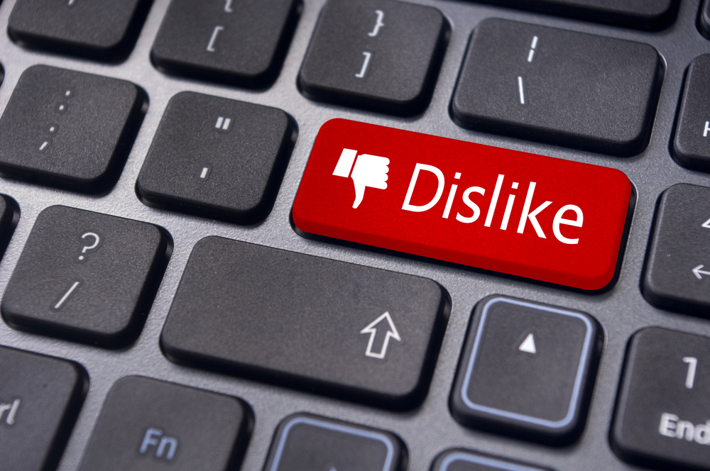 A dislike message on enter keyboard for anti social media concepts