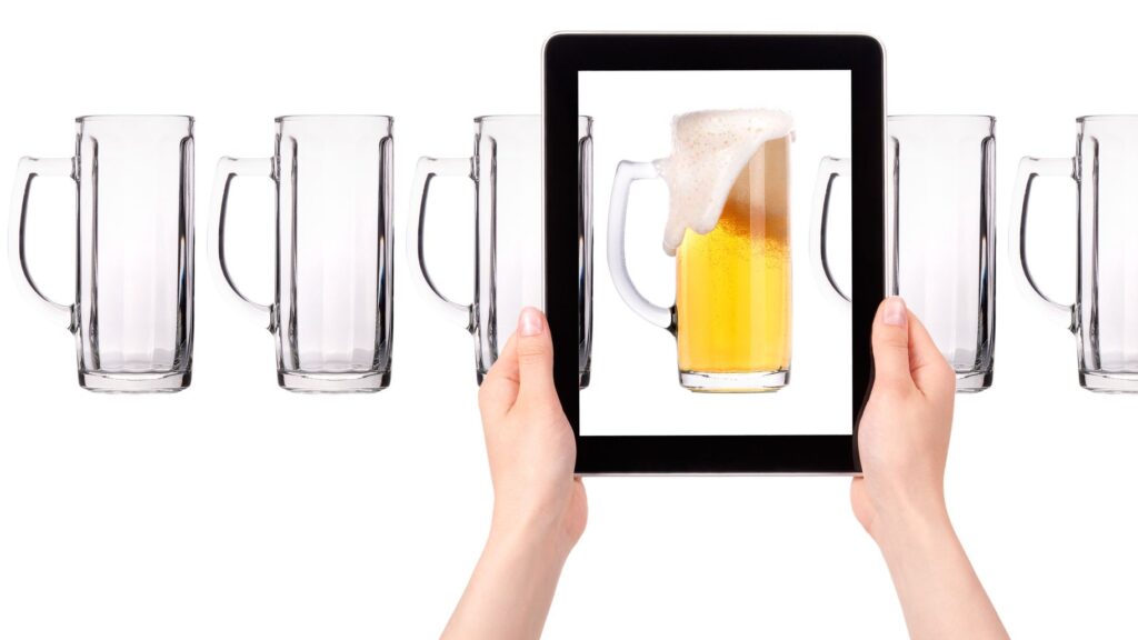 empty and one full beer on tablet computer screen isolated on a white background