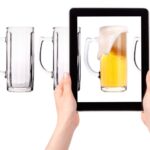 empty and one full beer on tablet computer screen isolated on a white background