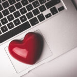 Red heart on laptop keyboard